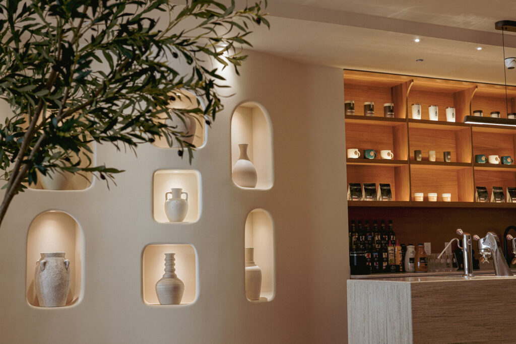 Interior design of Yemeni Coffee Shop in Manhattan New York featuring pottery, a bar, and lighting